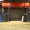 Large roll up door under the pressbox leads to stock pens
